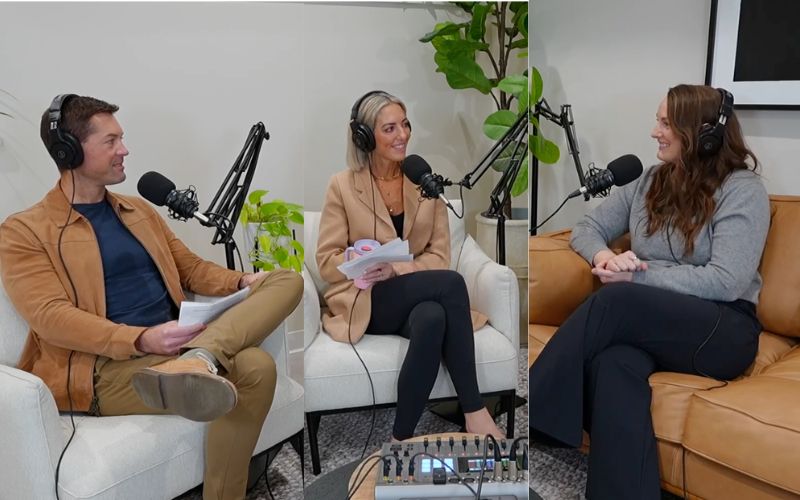 three people with headsets sitting on a couch in a talk show format