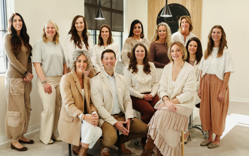 group photo of 12 women and 1 man